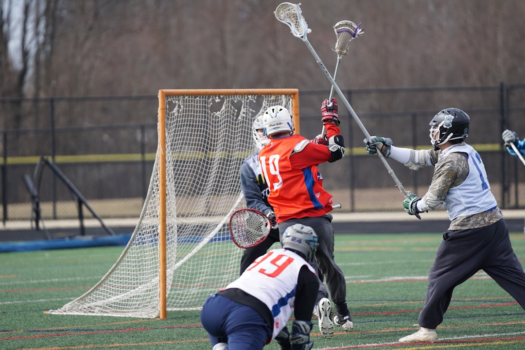 Lacrosse player shooting with premium shaft