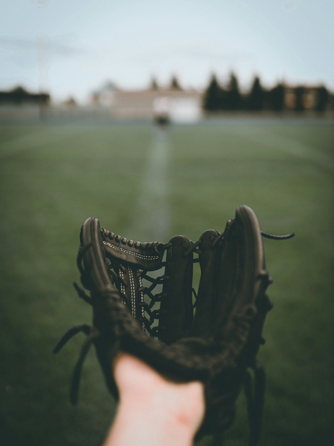 Lacrosse player scooping ground ball
