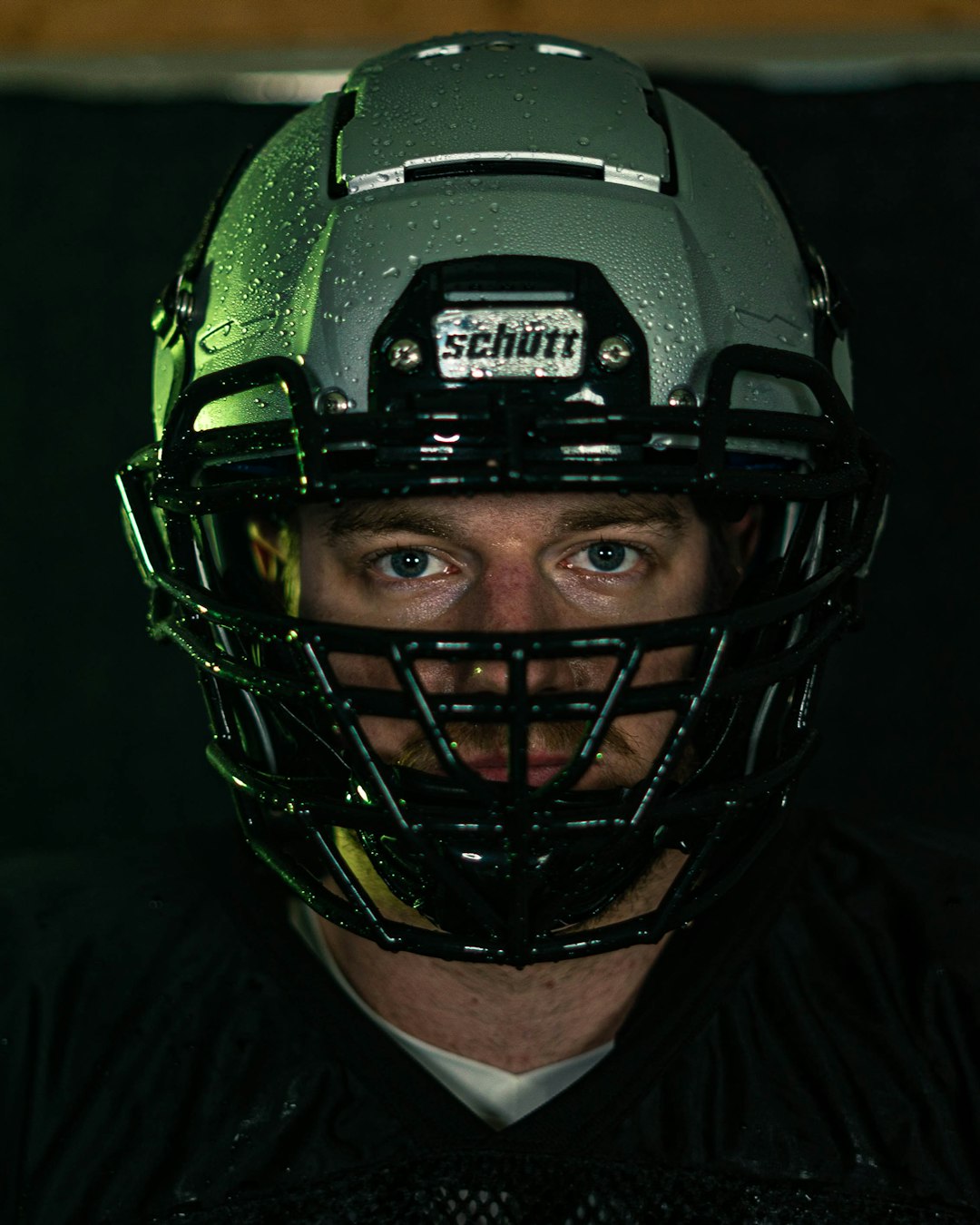 Lacrosse player on field wearing helmet