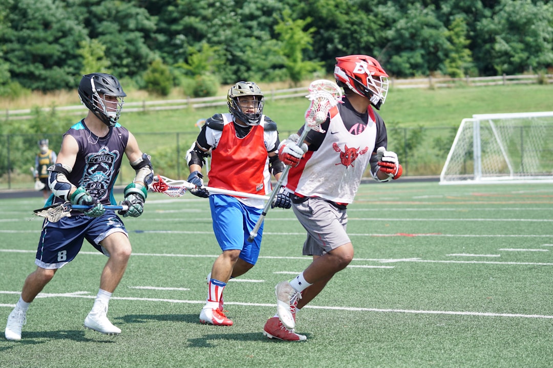 Lacrosse attacker dodging defender