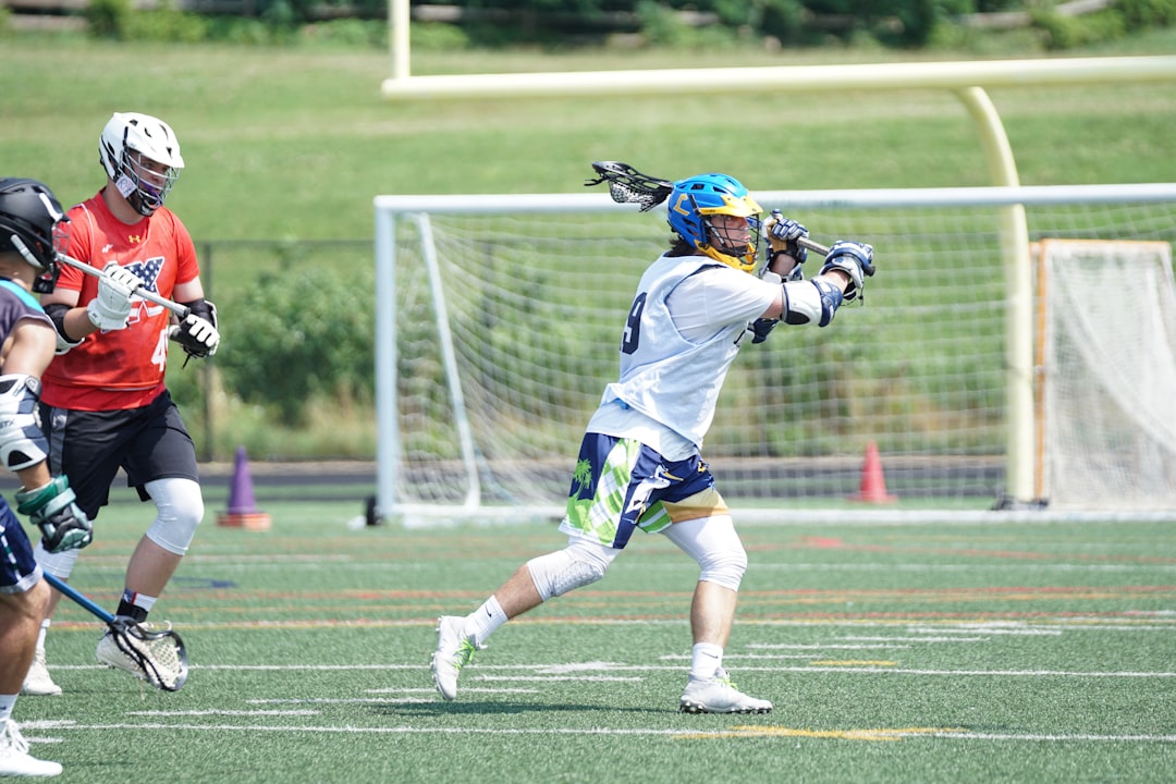 Lacrosse player attacking goal in gloves